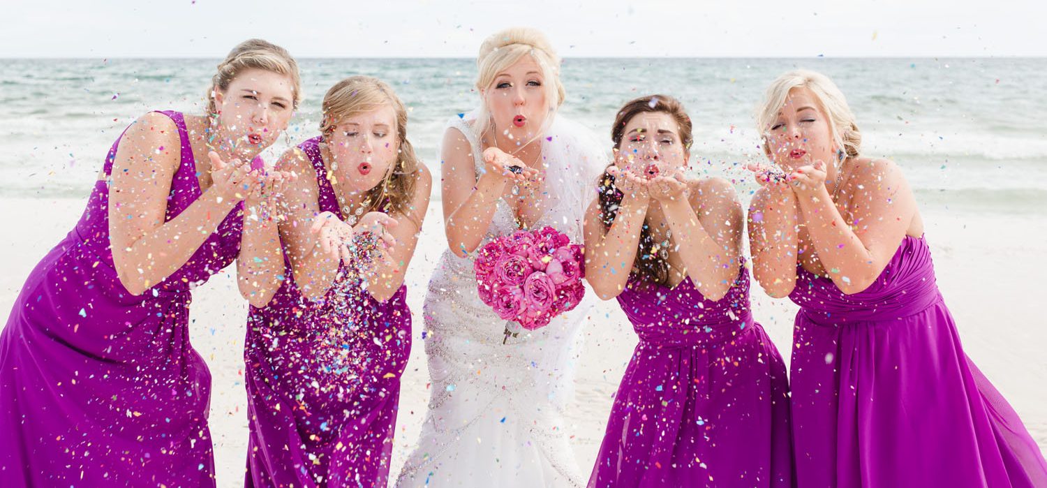 Island Sands Beach Weddings Bride Blowing Confetti